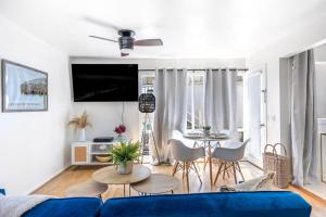 a living room with a blue couch and a table at San Clemente Sunset in San Clemente