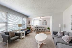 a living room with a couch and a table at Evening Oasis in Orange