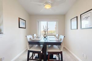 a dining room with a table and chairs and a window at Monarch Vista in Dana Point +11 photos