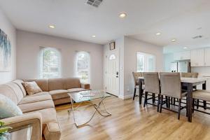 a living room with a couch and a table at Sunshine Fun Time in Newport Beach