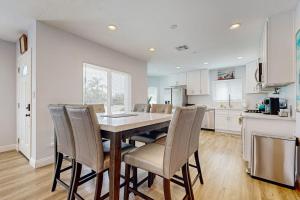 a kitchen and dining room with a table and chairs at Sunshine Fun Time in Newport Beach