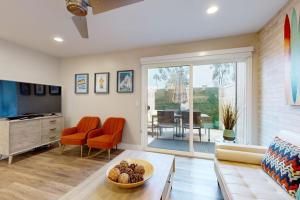 a living room with a couch and a table at On the Doorstep in Anaheim