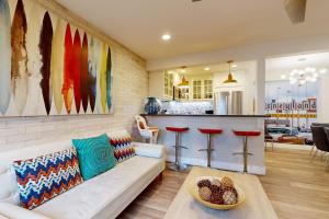a living room with a couch and a bar at On the Doorstep in Anaheim