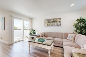 a living room with a couch and a coffee table at Sunny Days in Newport Beach