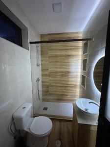 a bathroom with a toilet and a sink at Casa da Tá in Espargos +1 photo