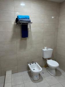 a bathroom with a toilet and a sink at Finca Luz in Santiago del Estero