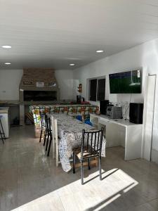 a dining room with a table and chairs in a kitchen at Finca Luz in Santiago del Estero +9 photos