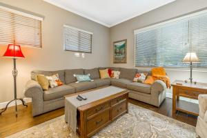 a living room with a couch and a table at Berry House in Arroyo Grande