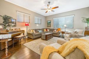 a living room with a couch and a piano at Berry House in Arroyo Grande
