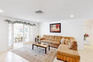a living room with a couch and a table at Fred Waring Dreams in Palm Desert +20 photos