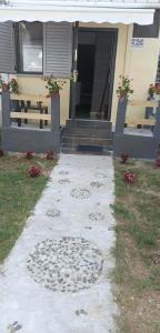 a house with a walkway in front of a house at Fatos in Pogradec +1 photo