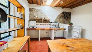 a large kitchen with a counter in a room at Luminous Haven Atitlan #1 in San Marcos La Laguna