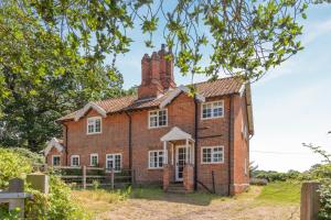 an old red brick house with two chimneys at 3 Bed in Dunwich oc-atc2 in Dunwich