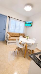 a living room with a table and chairs and a couch at San bernardo relax in San Bernardo