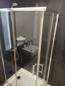 a bathroom with a shower and a sink at Casa das 3 Oliveiras in Porto Santo +13 photos