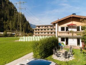 a house with a car parked in front of it at Regenbogenhaus in Mayrhofen