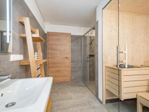 a bathroom with a white tub and a shower at Steier Hütte in Donnersbachwald +36 photos