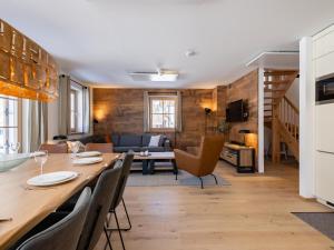 a kitchen and living room with a table and chairs at Steier Hütte in Donnersbachwald