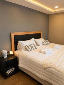a bedroom with a bed with white sheets and pillows at Reserva Itay in Luque +16 photos
