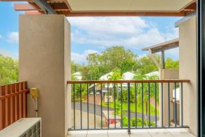 a balcony with a view of a street at Bluewater Haven - Sweeping Lagoon Views with Pool in Trinity Beach