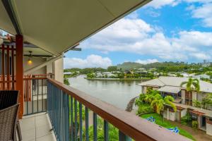 a balcony with a view of a river at Bluewater Haven - Sweeping Lagoon Views with Pool in Trinity Beach