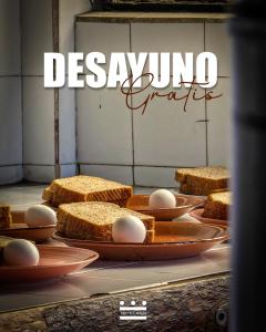 a bunch of breads on a table with eggs on them at 13 Cielos Hostel & Coworking in San Cristóbal de Las Casas