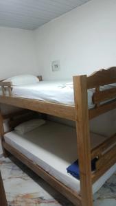 a couple of bunk beds in a room at Los Clemones in Rincón +6 photos