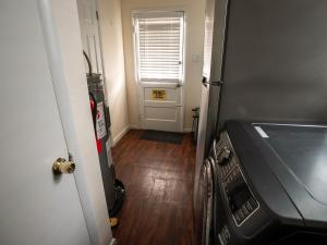 a door leading to a room with a hallway with a door at Coastal Home at Edgewater in Pleasantville +67 photos