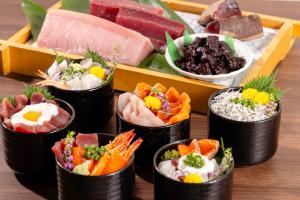 a tray of different types of food on a table at Hotel Mariners Court Tokyo in Tokyo
