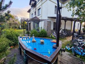 a ping pong table in front of a house at Willa Hydrograf - rowery i parking bezpłatnie in Ustka
