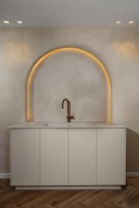 a bathroom with a sink and an arch at פנינת חמד Pninat Chemed in Safed