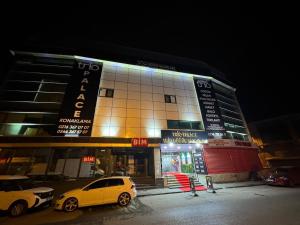 a building with a yellow car parked in front of it at Trio Palace in Istanbul