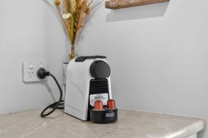 a hair dryer sitting on a table next to a wall at Marina Breeze - Excelsior Pde in Hindmarsh Island