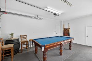 a pool table in the middle of a room at Marina Breeze - Excelsior Pde in Hindmarsh Island