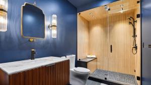 a bathroom with a shower and a toilet and a sink at Bates Ridge by AvantStay in Tannersville +38 photos