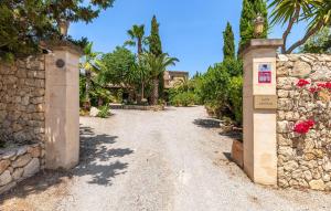 an entrance to a home with a stone wall at Estrella - Son Jorbo in Porreres +10 photos