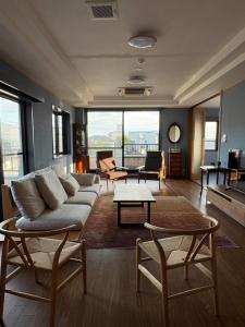 a living room with a couch and a table at はなれ香 in Kirishima