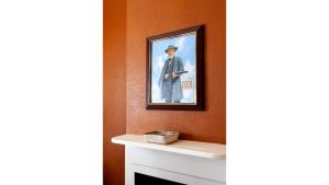 a picture of a man in a hat on a wall at Doc Holiday in Cimarron