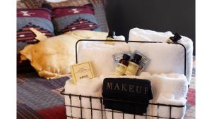 a basket filled with towels on top of a bed at Fred Lambert in Cimarron
