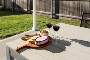a table with two glasses of red wine and bread at 15B Bolton Street in Berridale
