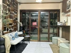 a room with a store with a door with a sale sign at ELNIDO BUDGET INN SILVERISE Pension in El Nido