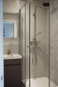 a bathroom with a shower and a sink at Salt Rooms in Scarborough