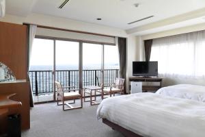 a hotel room with a bed and a large window at Ooedo Onsen Monogatari Beppu Seifu in Beppu +19 photos