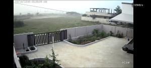an aerial view of a courtyard with a fence and a field at Relax Holiday Guest House in Kākināda +3 photos