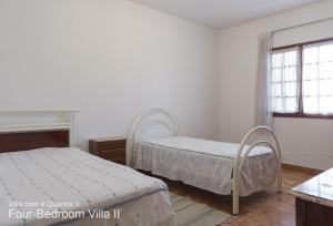 Krevet ili kreveti u jedinici u okviru objekta Akivillas Quarteira Rose