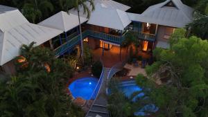 an aerial view of a house with a swimming pool at The Zoo House in Broome