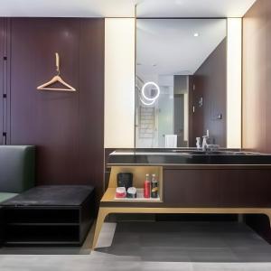 a bathroom with a sink and a mirror at CitiGO Hotel Shanghai Xujiahui in Shanghai +25 photos