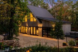 a barn style house with a black roof at Art & Soul in Lyndhurst
