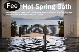 a magazine advertisement for a hot spring bath with a view of the water at Grand Prince Hotel Hiroshima in Hiroshima