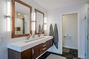 a bathroom with a sink and a large mirror at Prescott Mountain Luxury Escape! in Prescott